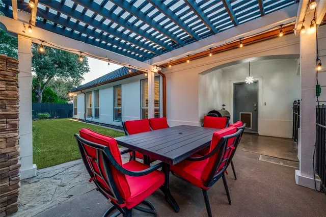a view of an outdoor sitting area with furniture and wooden deck