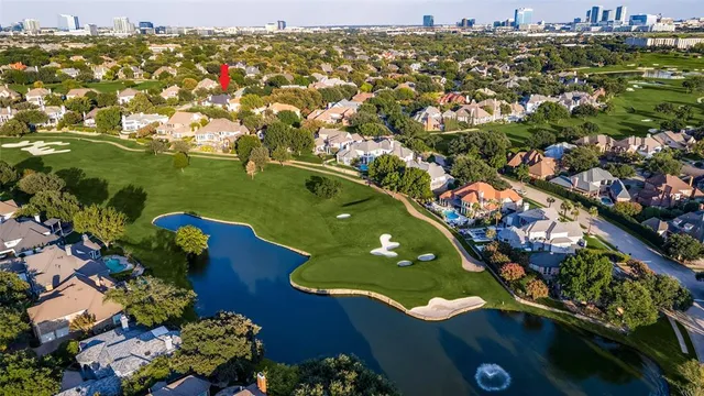an aerial view of a house with a yard lake view