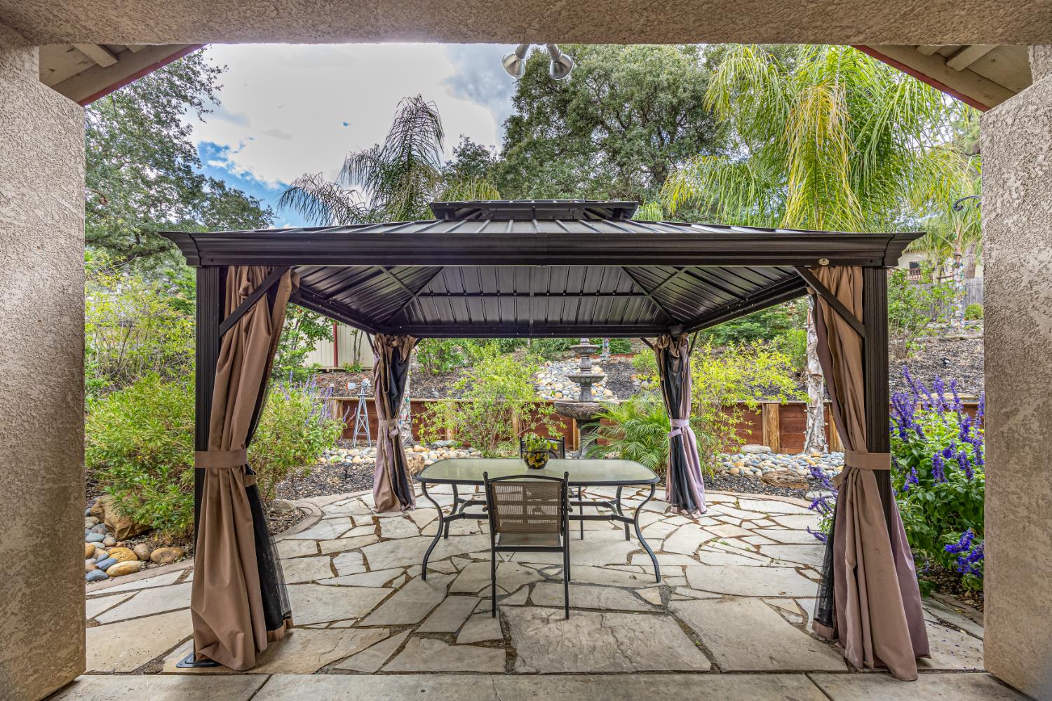 2083 State Rte 26 Valley Springs, CA 95252 - Photo 29 of 59 a view of patio with chairs and potted plants