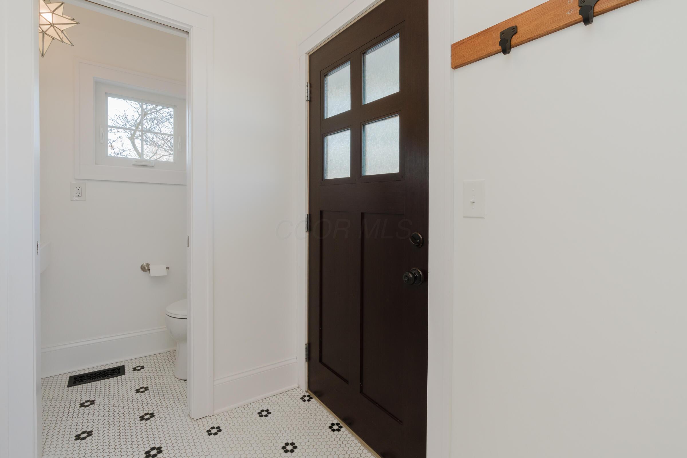278 Crestview Road Columbus, OH 43202 - Photo 20 of 50 The 2019 addition created space for the half bath and mudroom with timeless tile and fantastic space.