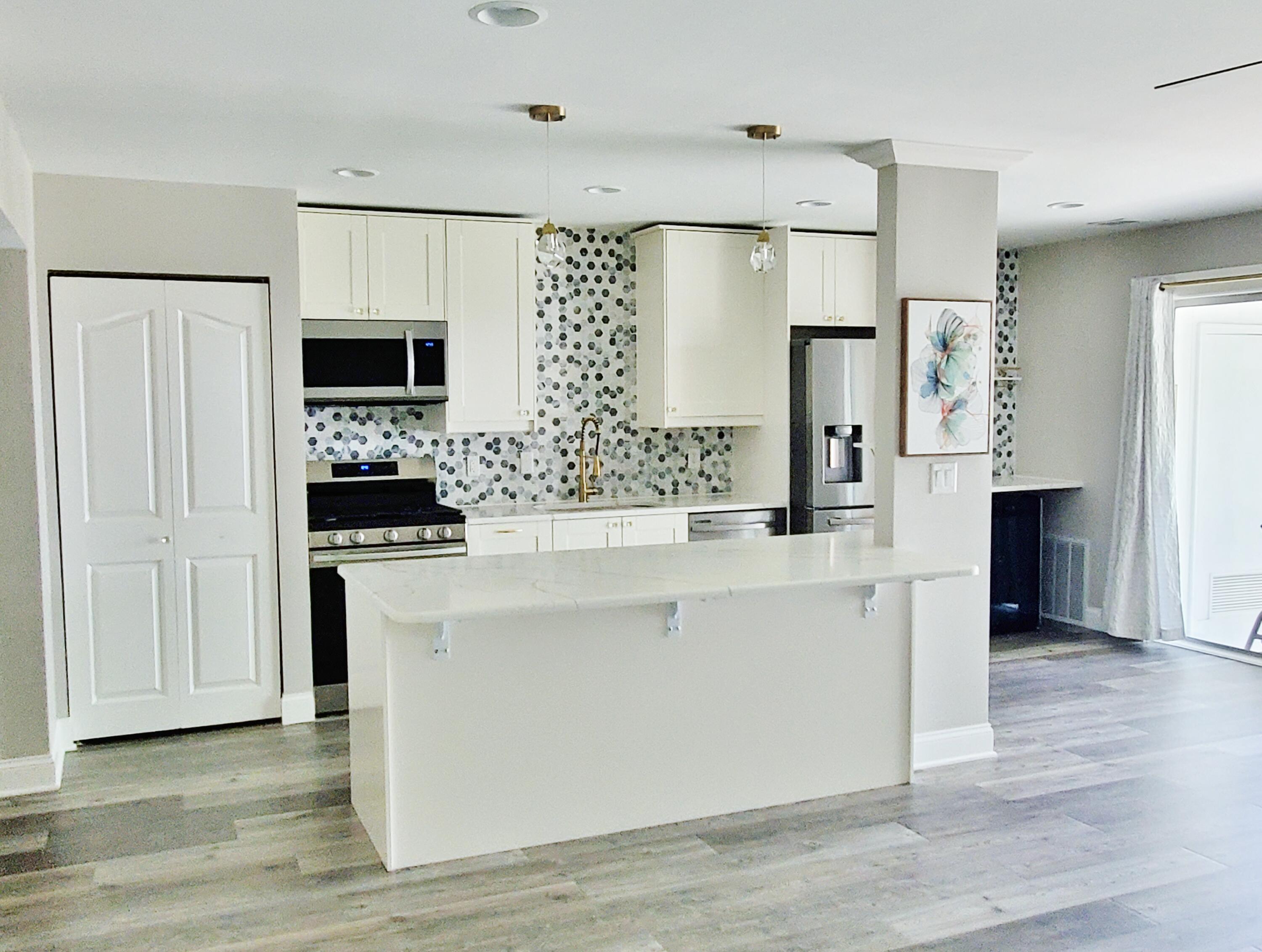 514 Birch Tree Lane Michigan City, IN 46360 - Photo 6 of 23 a kitchen with stainless steel appliances a refrigerator and a stove top oven
