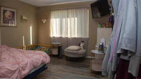 a bedroom with a bed and a couch