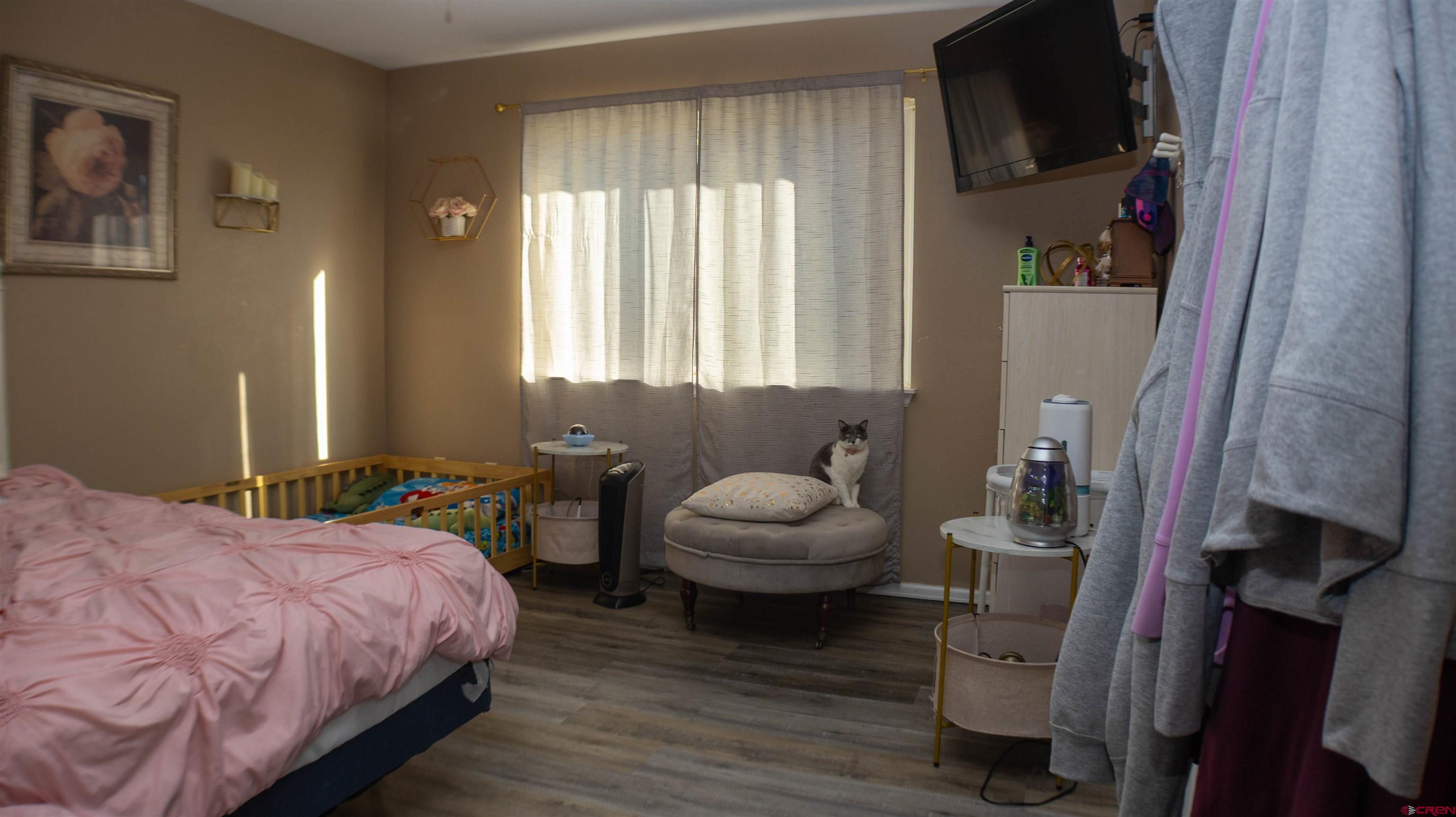 304 West 3rd Street Delta, CO 81416 - Photo 14 of 28 a bedroom with a bed and a couch