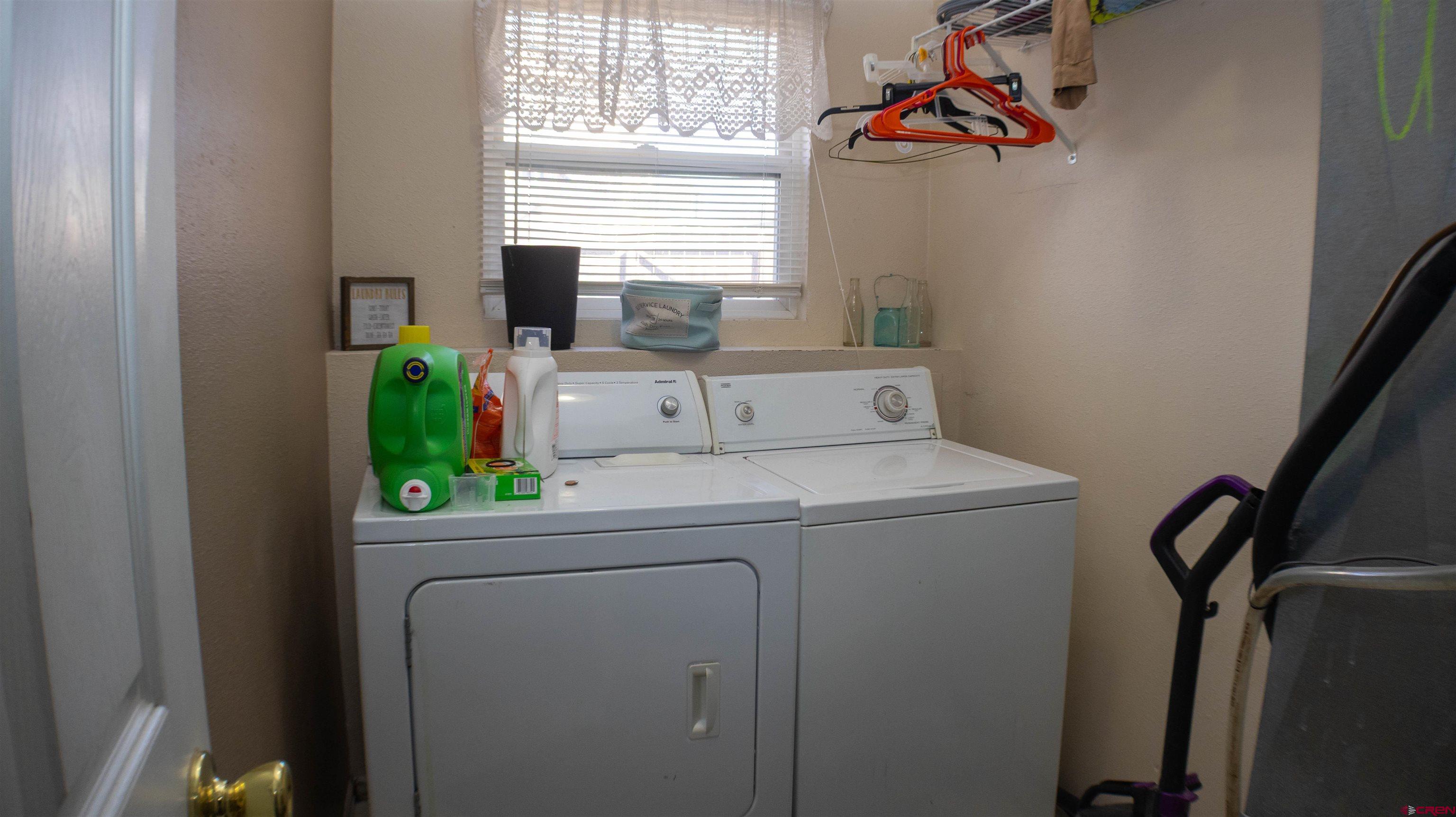 304 West 3rd Street Delta, CO 81416 - Photo 17 of 28 a utility room with dryer and window
