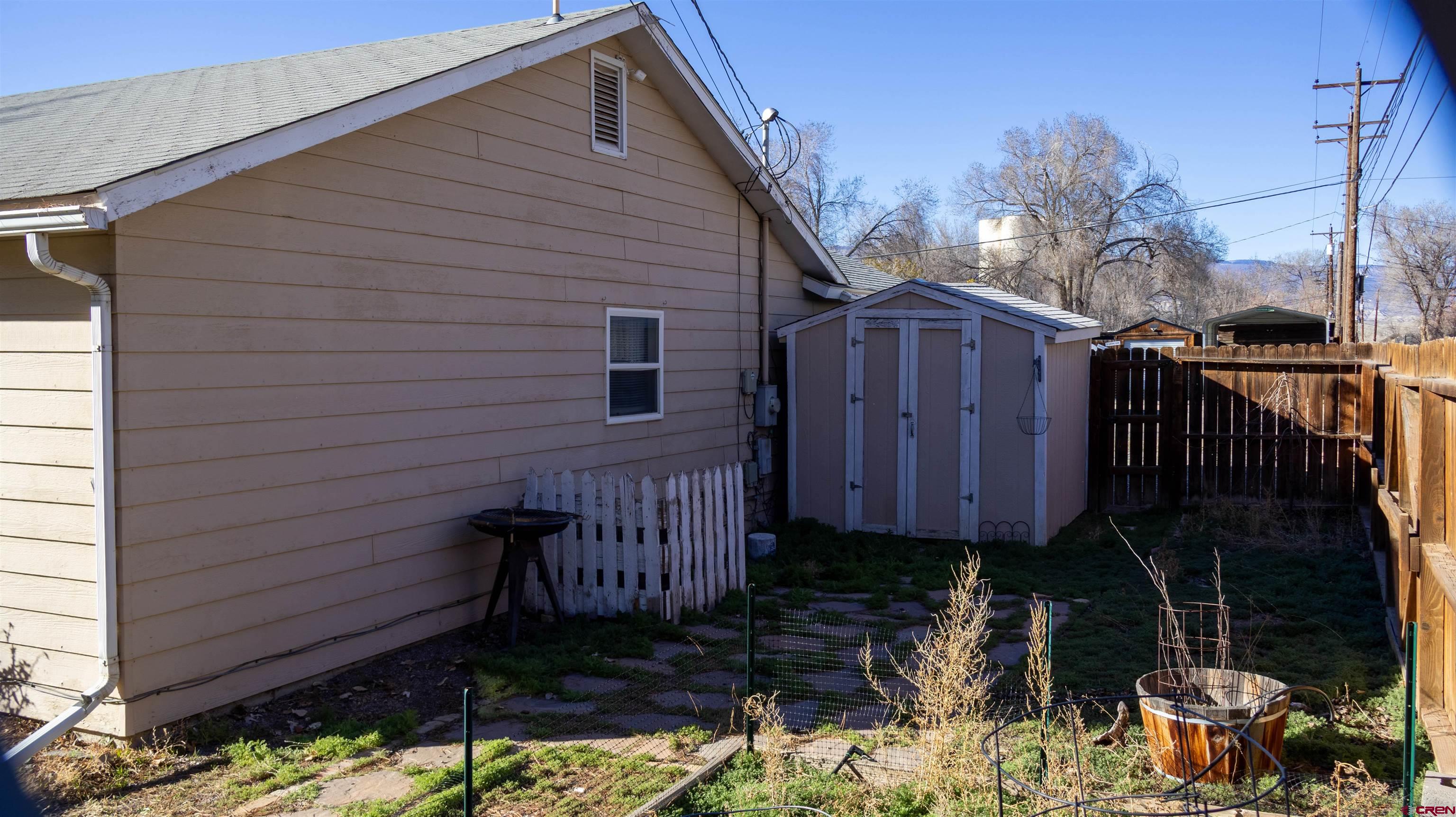 304 West 3rd Street Delta, CO 81416 - Photo 21 of 28 a front view of a house with garden