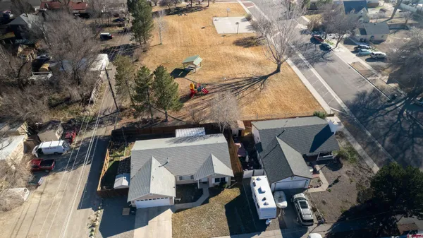 an aerial view of a multiple houses with yard