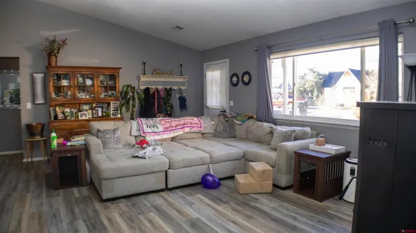 a living room with furniture and a large window