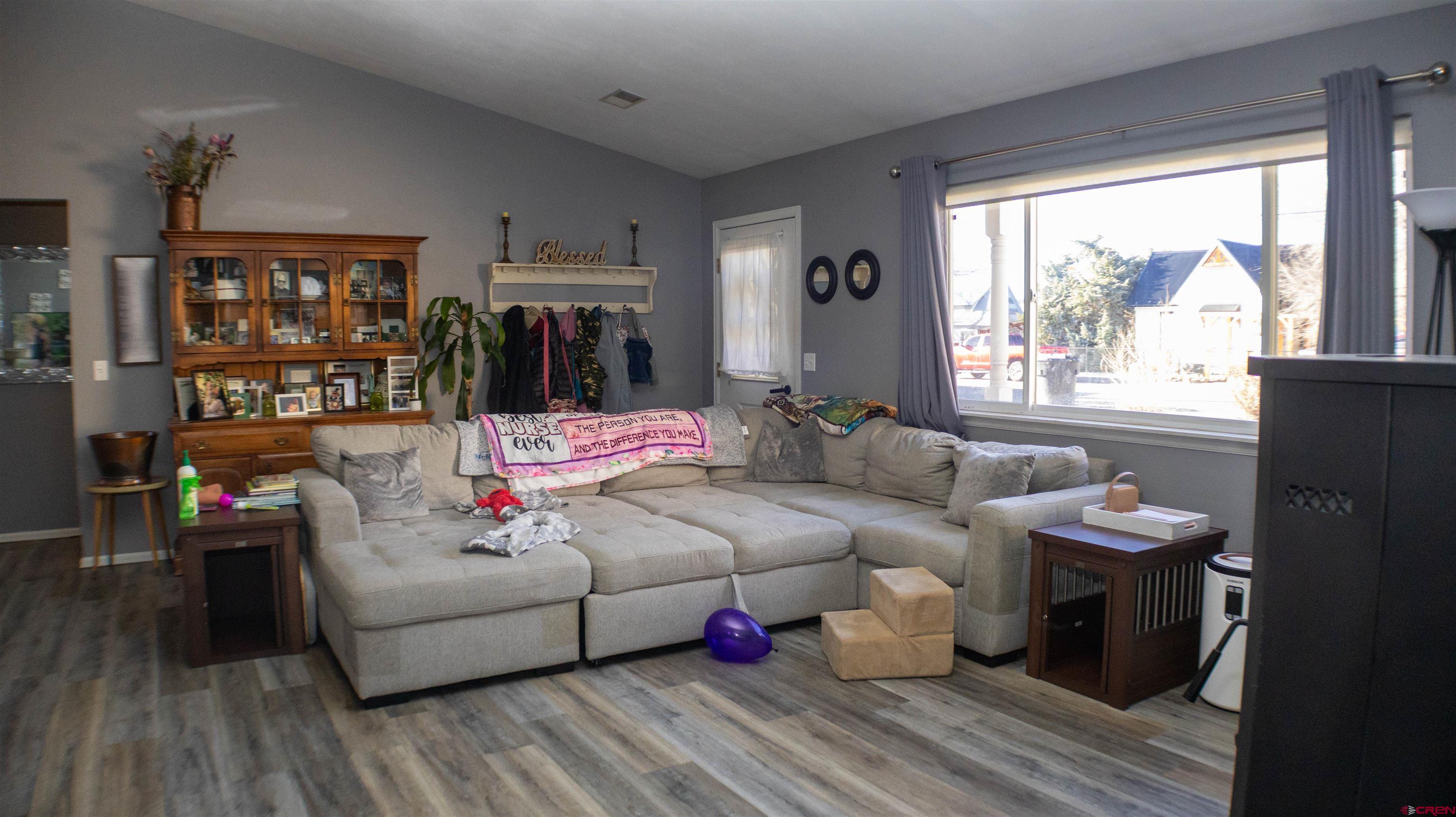 304 West 3rd Street Delta, CO 81416 - Photo 5 of 28 a living room with furniture and a large window