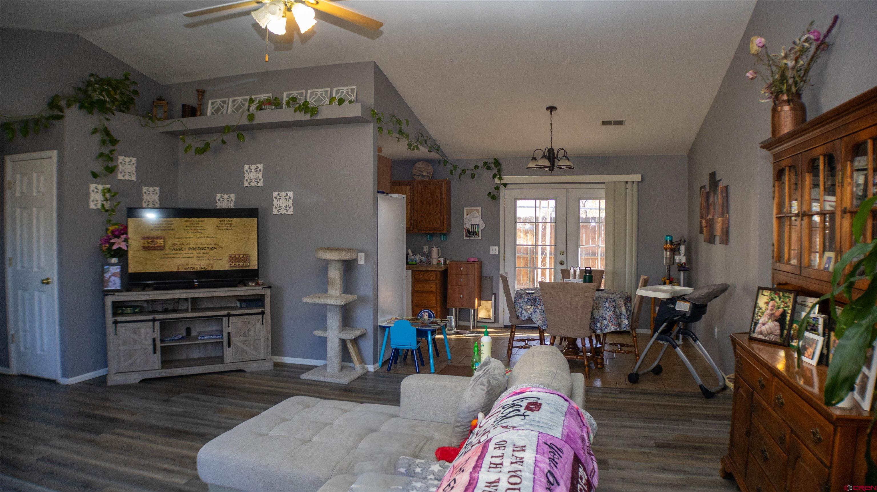 304 West 3rd Street Delta, CO 81416 - Photo 7 of 28 a living room with furniture and a flat screen tv