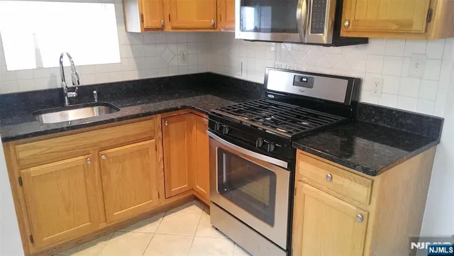 a view of a living room and entryway