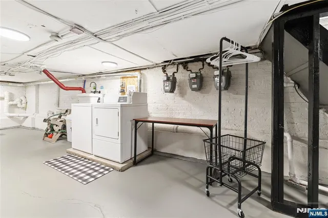 a view of a house with a small yard and wooden fence