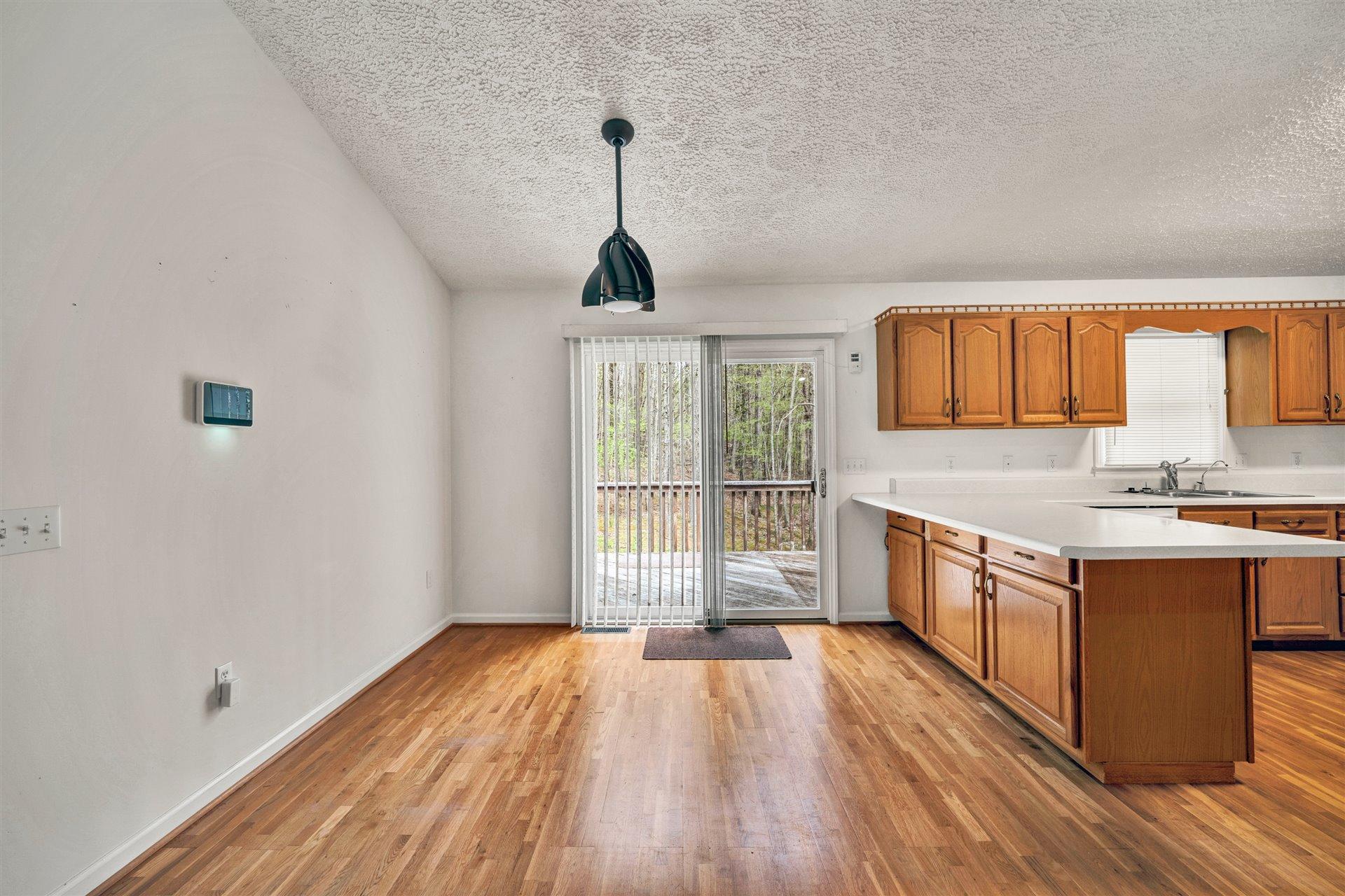 445 Middle Ridge Drive Callaway, VA 24067 - Photo 7 of 25 a open kitchen with a sink and dish washer