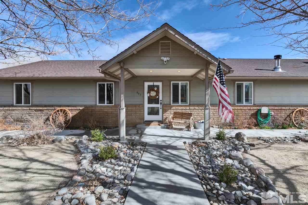 995 McLean Road Fallon, NV 89406 - Photo 1 of 25 a front view of a house with garden