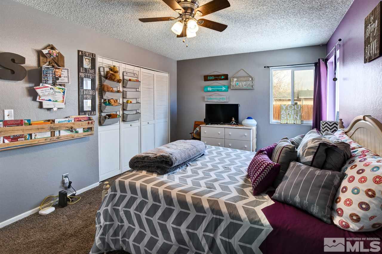 995 McLean Road Fallon, NV 89406 - Photo 12 of 25 a bedroom with a bed furniture and window