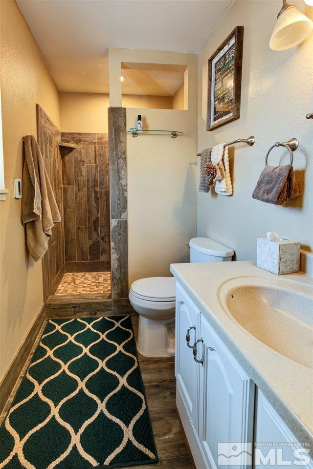 995 McLean Road Fallon, NV 89406 - Photo 13 of 25 a bathroom with a sink a toilet and shower