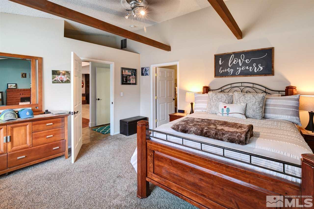 995 McLean Road Fallon, NV 89406 - Photo 14 of 25 a bedroom with a bed and a dresser