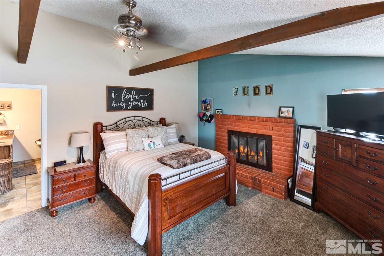 995 McLean Road Fallon, NV 89406 - Photo 15 of 25 a bedroom with a bed and a flat screen tv