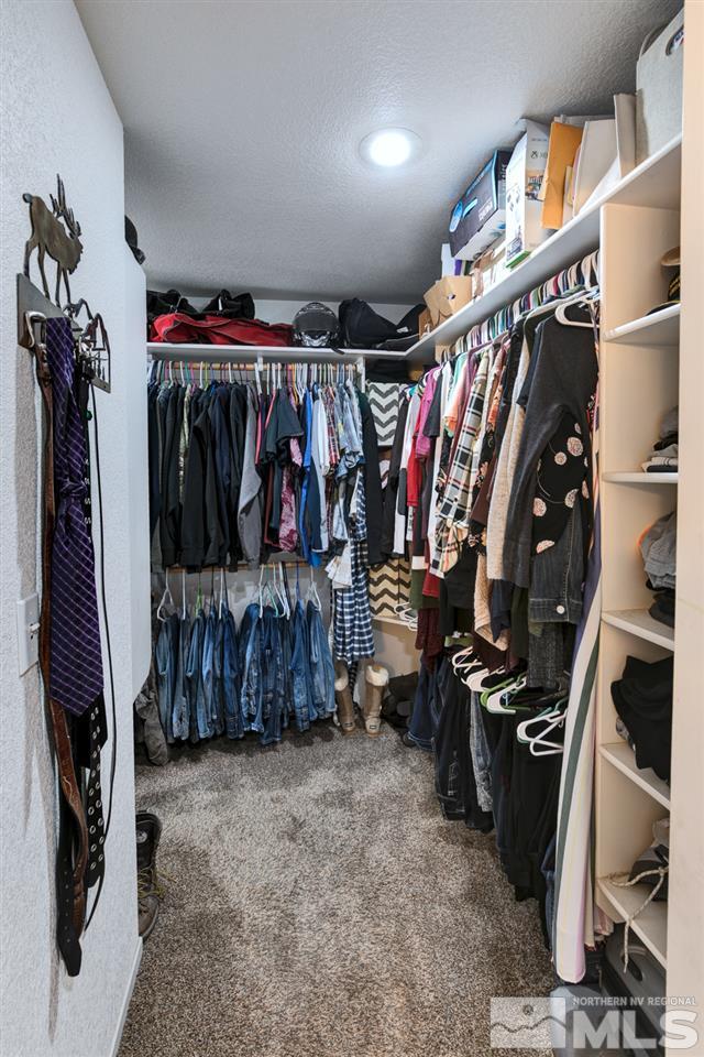 995 McLean Road Fallon, NV 89406 - Photo 16 of 25 a view of walk in closet with clothes