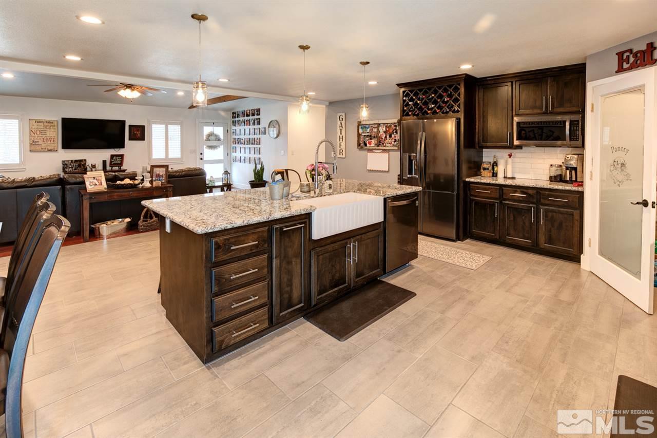 995 McLean Road Fallon, NV 89406 - Photo 5 of 25 a large kitchen with stainless steel appliances kitchen island granite countertop a large counter top stainless steel appliances and cabinets