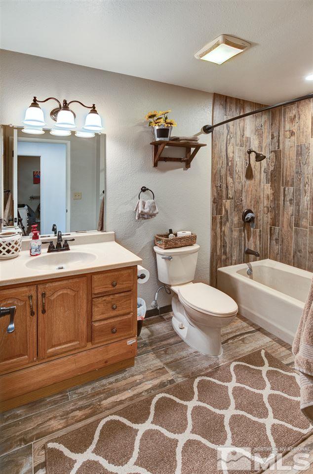 995 McLean Road Fallon, NV 89406 - Photo 10 of 25 a spacious bathroom with a double vanity sink mirror and toilet