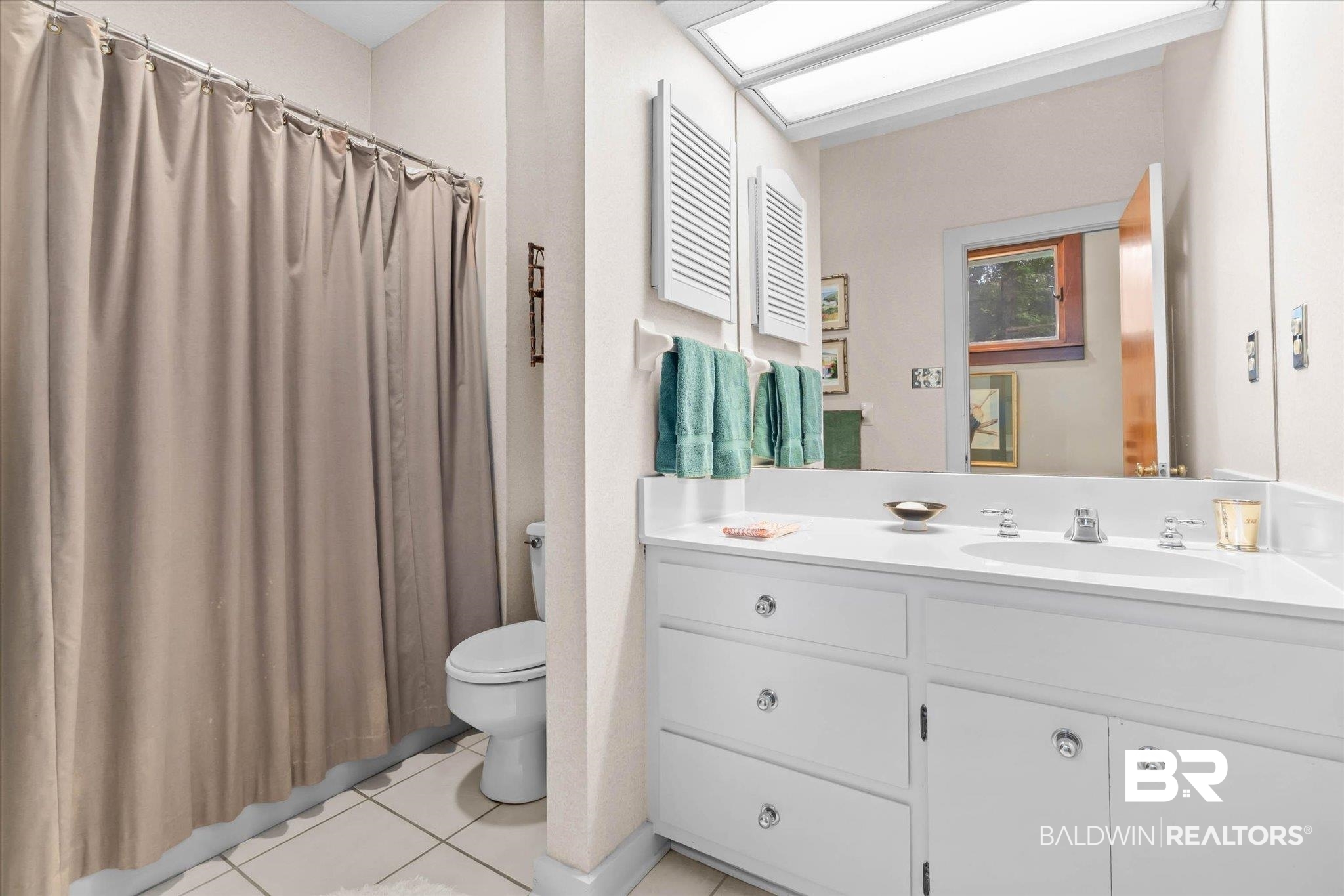 3500 Venetia Road Mobile, AL 36605 - Photo 22 of 56 Bathroom featuring a double vanity with white cabinetry, integrated sinks, and chrome fixtures