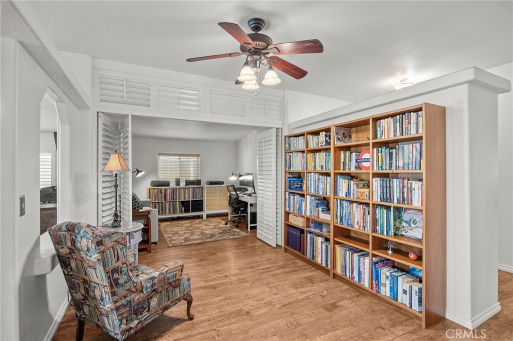 23301 Ridge Rte Drive, Unit 229 Laguna Hills, CA 92653 - Photo 11 of 28 a living room with furniture and a book shelf
