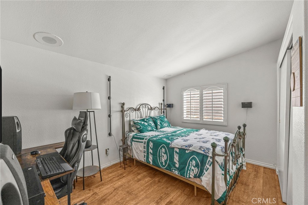 23301 Ridge Rte Drive, Unit 229 Laguna Hills, CA 92653 - Photo 17 of 28 a bedroom with two beds and a desk