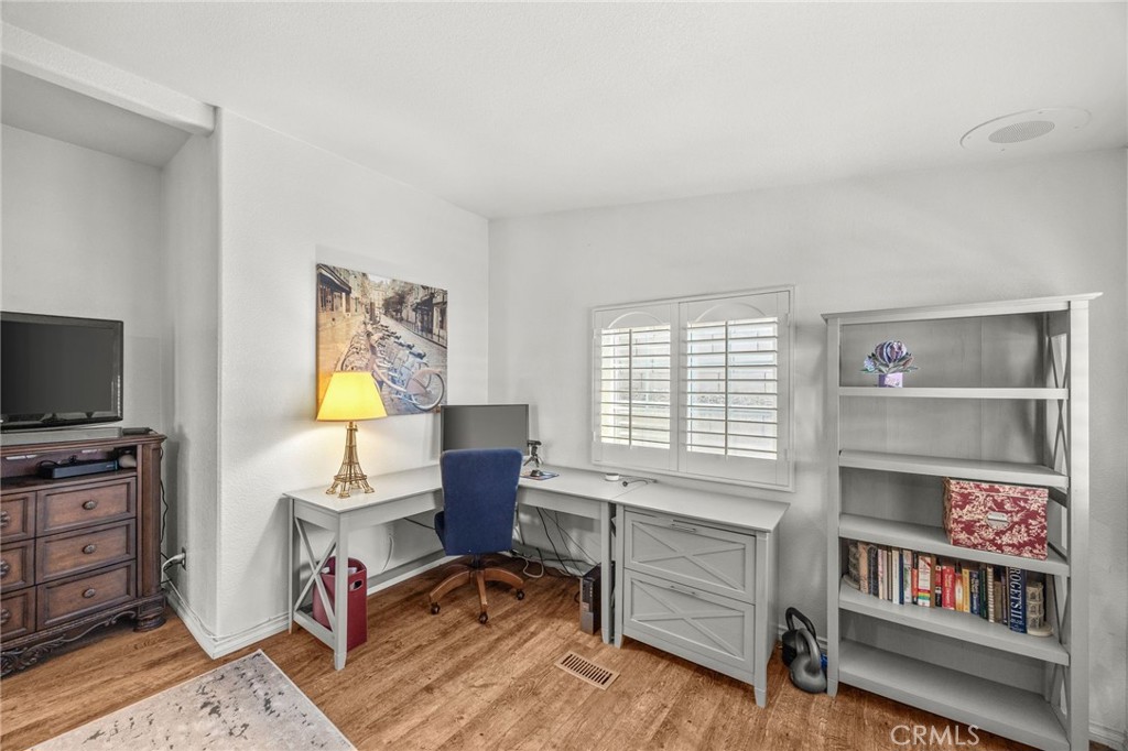 23301 Ridge Rte Drive, Unit 229 Laguna Hills, CA 92653 - Photo 21 of 28 a view of a workspace with furniture and a window