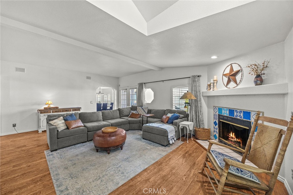 23301 Ridge Rte Drive, Unit 229 Laguna Hills, CA 92653 - Photo 4 of 28 a living room with furniture and a fireplace