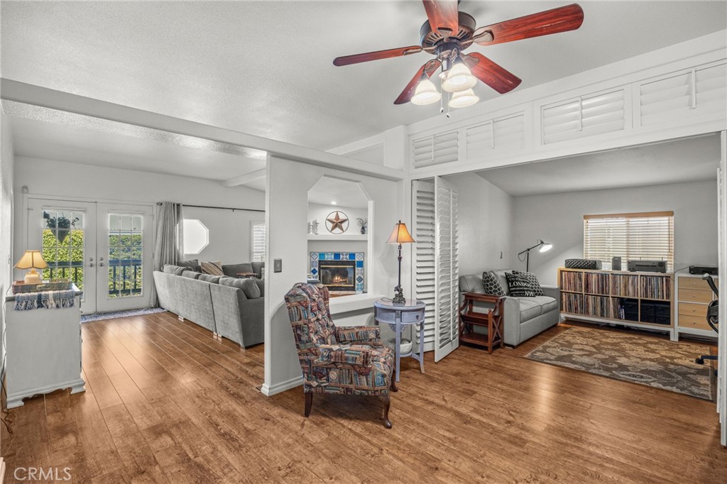 23301 Ridge Rte Drive, Unit 229 Laguna Hills, CA 92653 - Photo 10 of 28 a living room with furniture and wooden floor