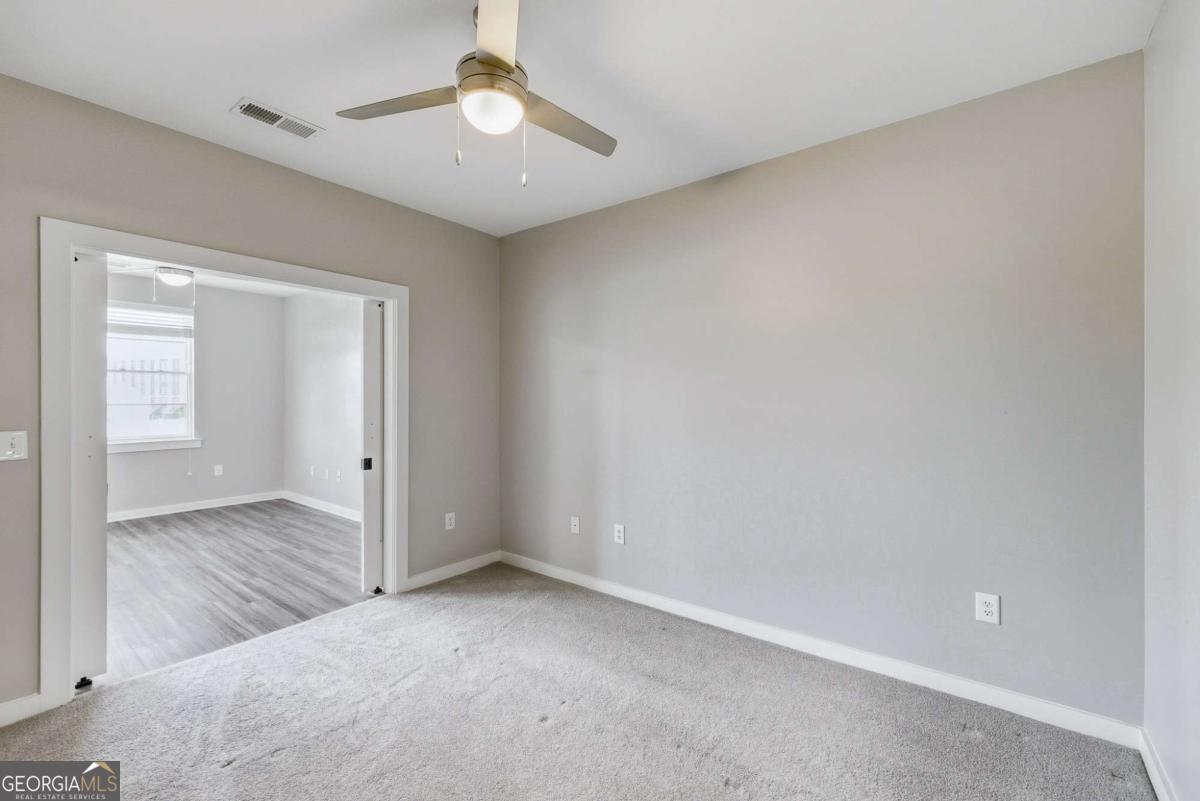 100 Prince Avenue, Unit A407 Athens, GA 30601 - Photo 17 of 27 an empty room with a bathroom