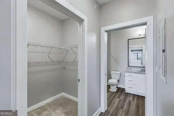 a bathroom with a glass shower door
