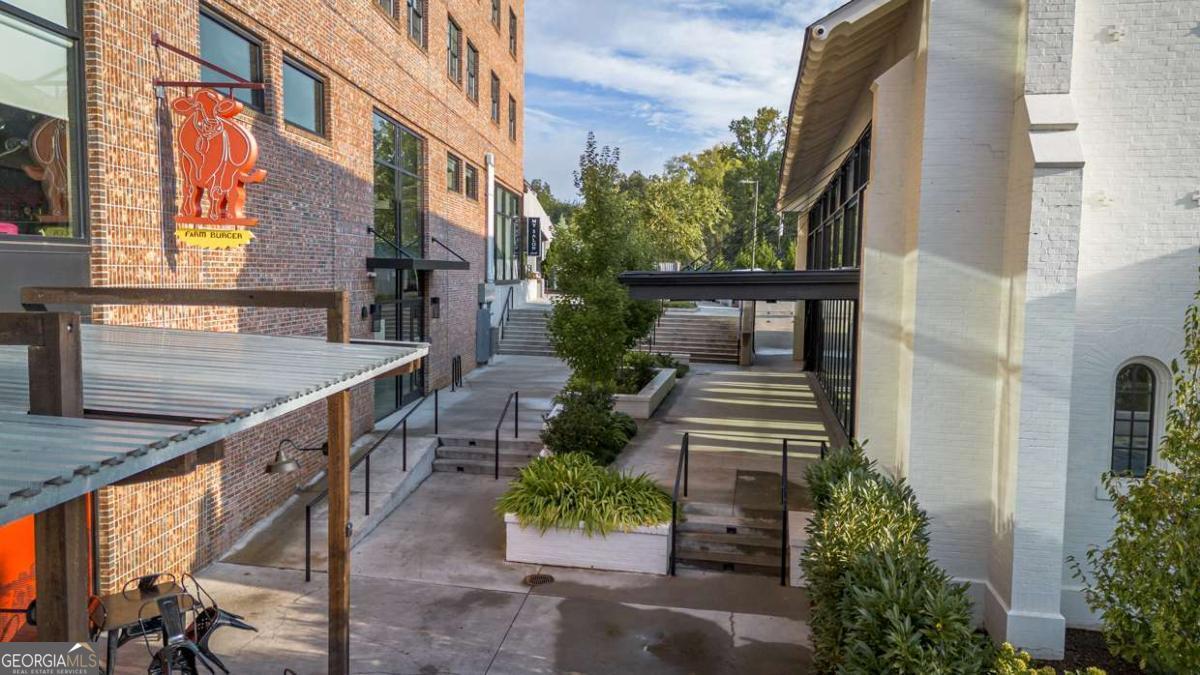 100 Prince Avenue, Unit A407 Athens, GA 30601 - Photo 27 of 27 a view of a pathway with a potted plants