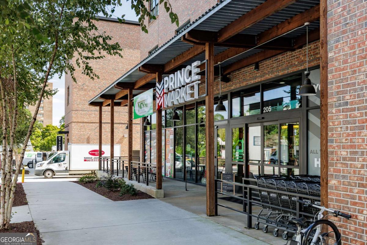 100 Prince Avenue, Unit A407 Athens, GA 30601 - Photo 6 of 27 a building outdoor space with seating space