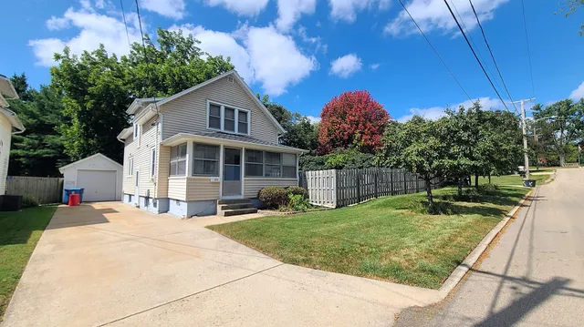 a backyard of a house with portable swimming pool