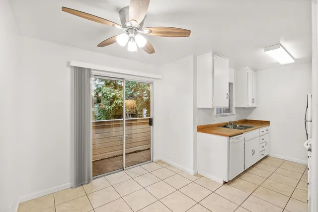 a kitchen that has a sink and a stove in it