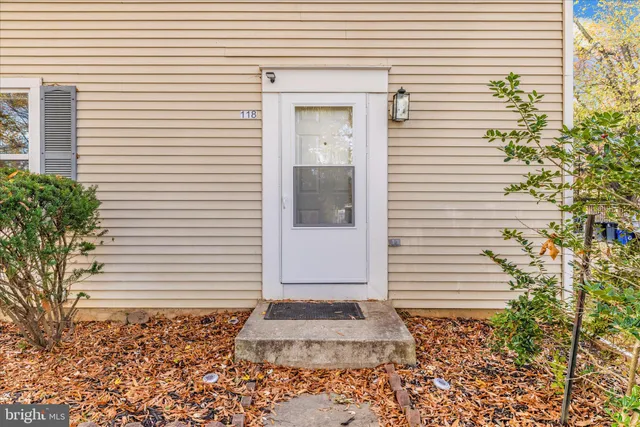 a view of a house with a yard covered in snow