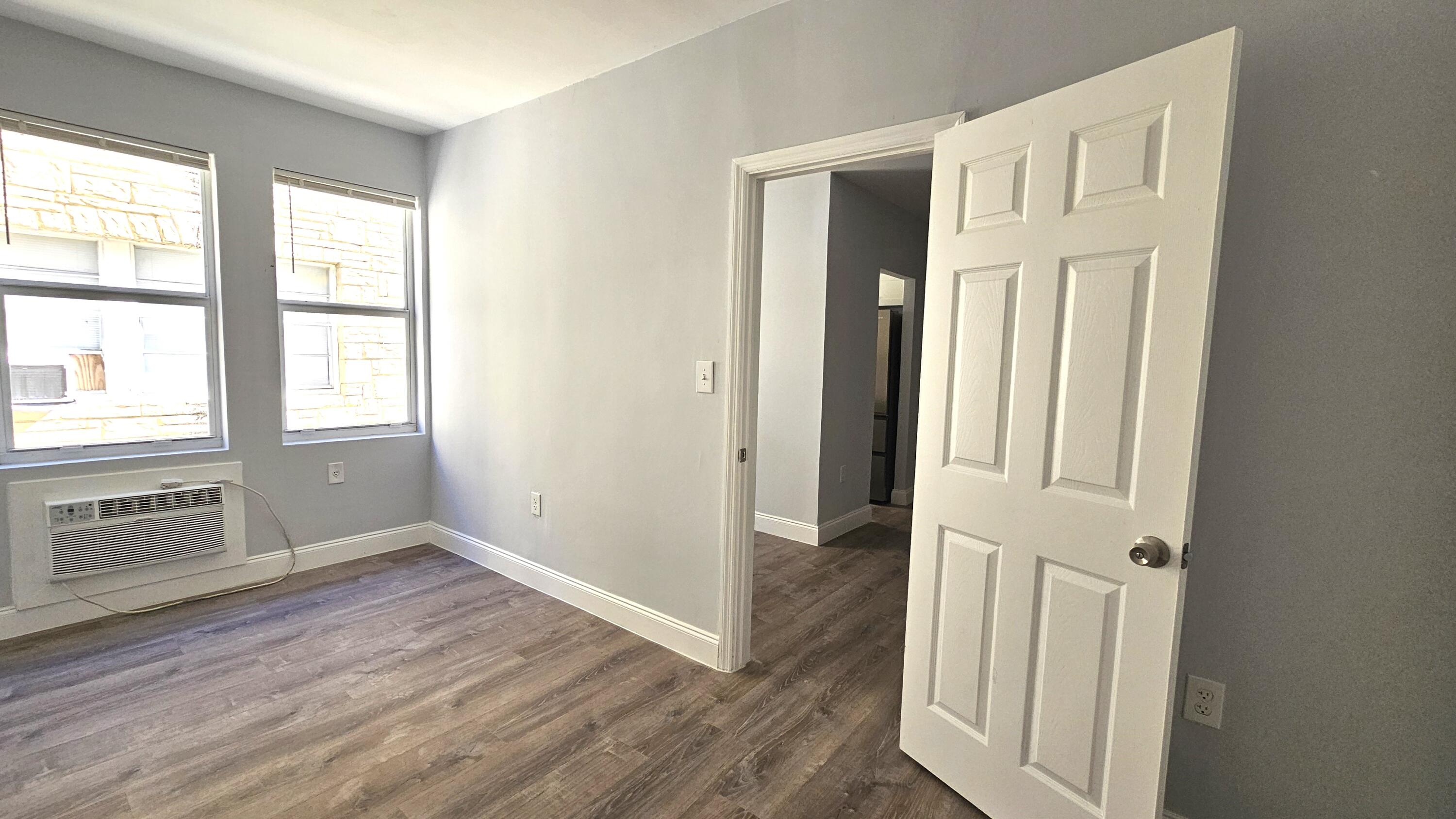 1142 Southwest 4th Street, Unit 9 Miami, FL 33130 - Photo 4 of 9 an entryway with wooden floor and cabinet