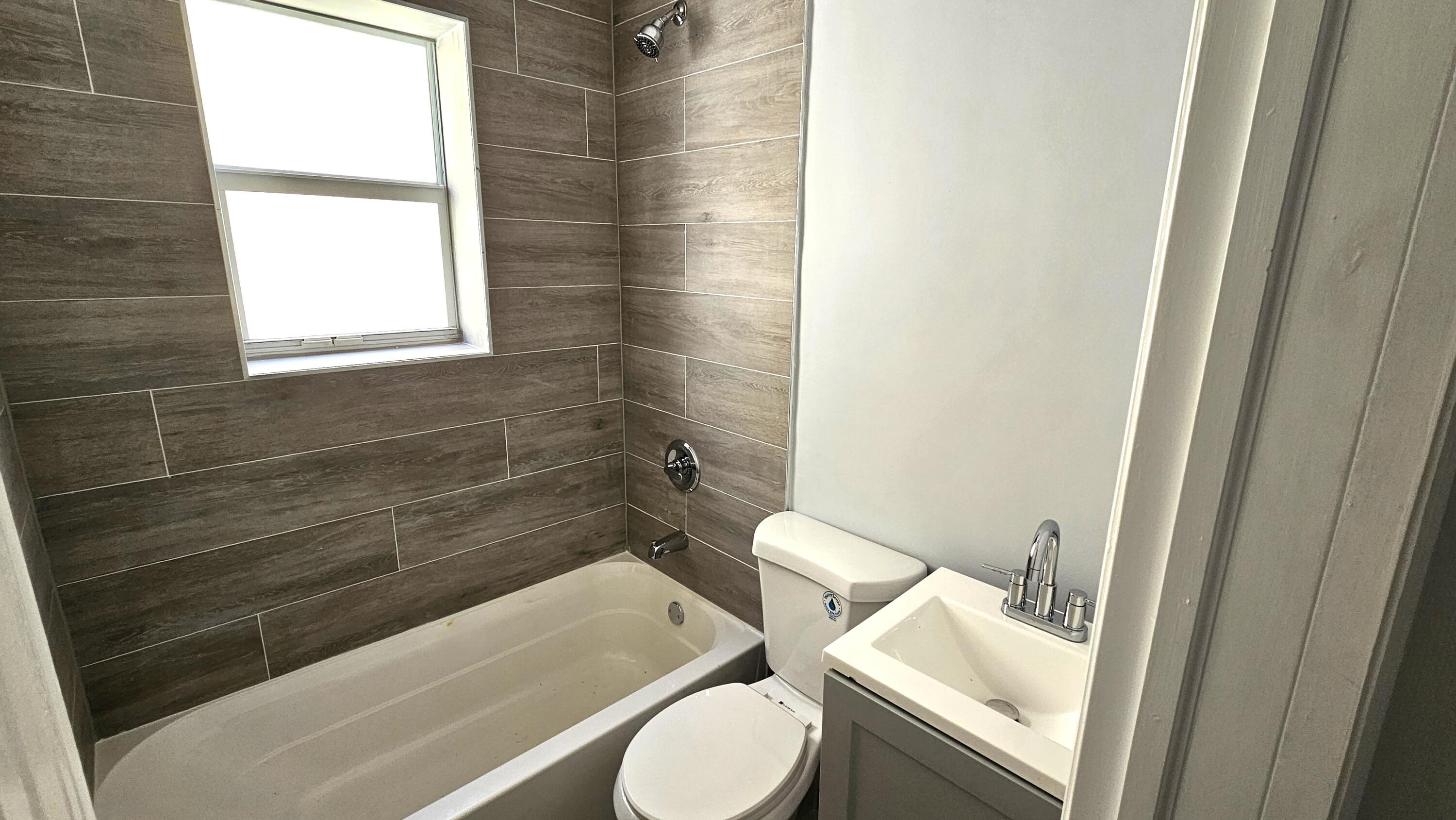 1142 Southwest 4th Street, Unit 9 Miami, FL 33130 - Photo 7 of 9 a bathroom with a toilet and a sink