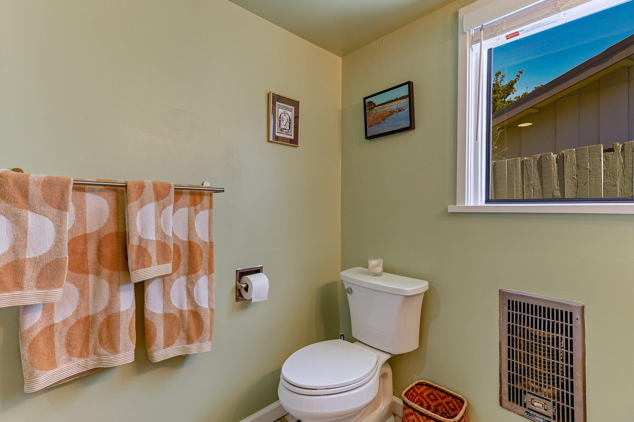 860 Rio Street Red Bluff, CA 96080 - Photo 24 of 50 a bathroom with a toilet and a shower curtain