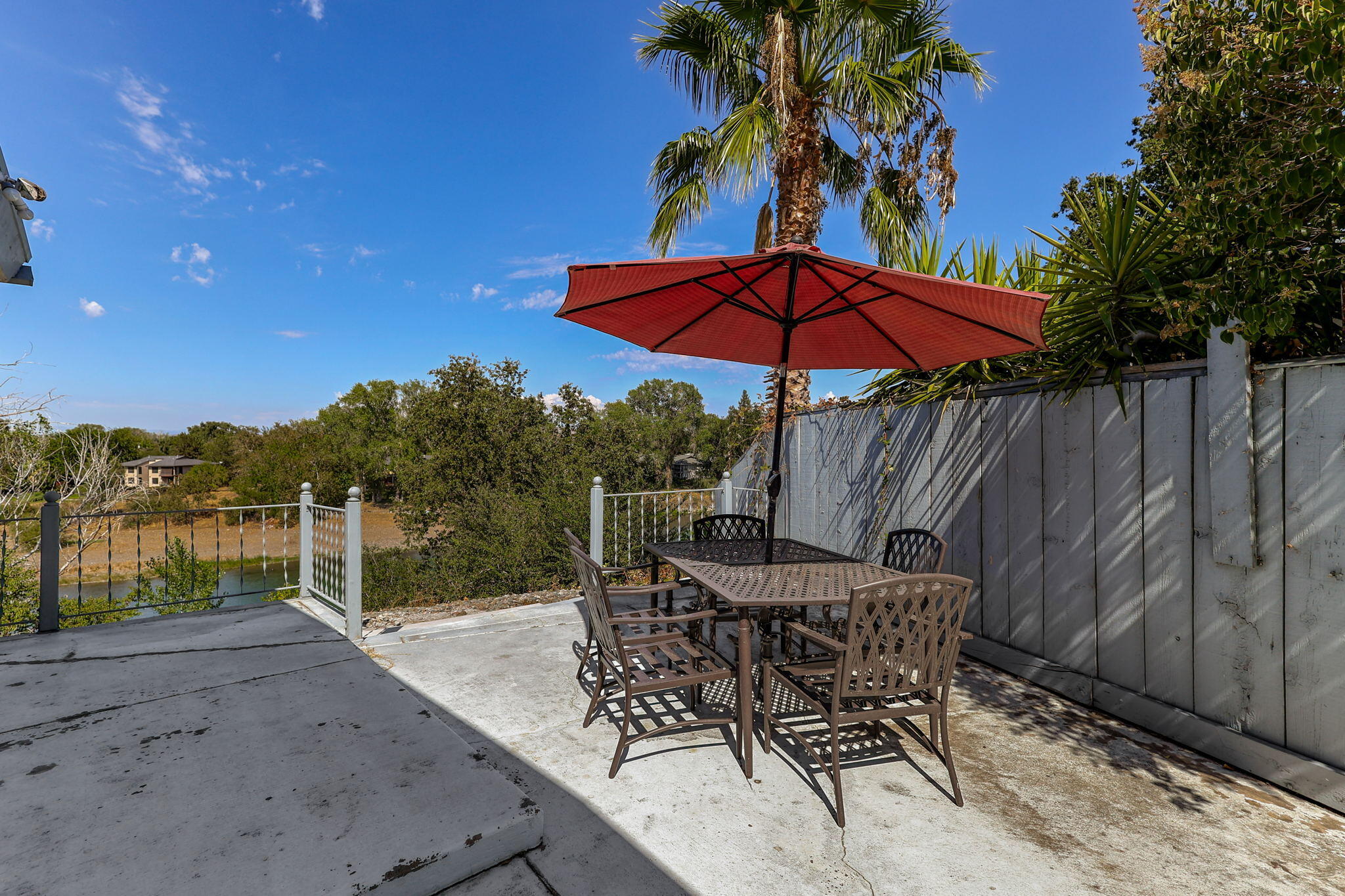 860 Rio Street Red Bluff, CA 96080 - Photo 42 of 50 a patio with a table and chairs under an umbrella