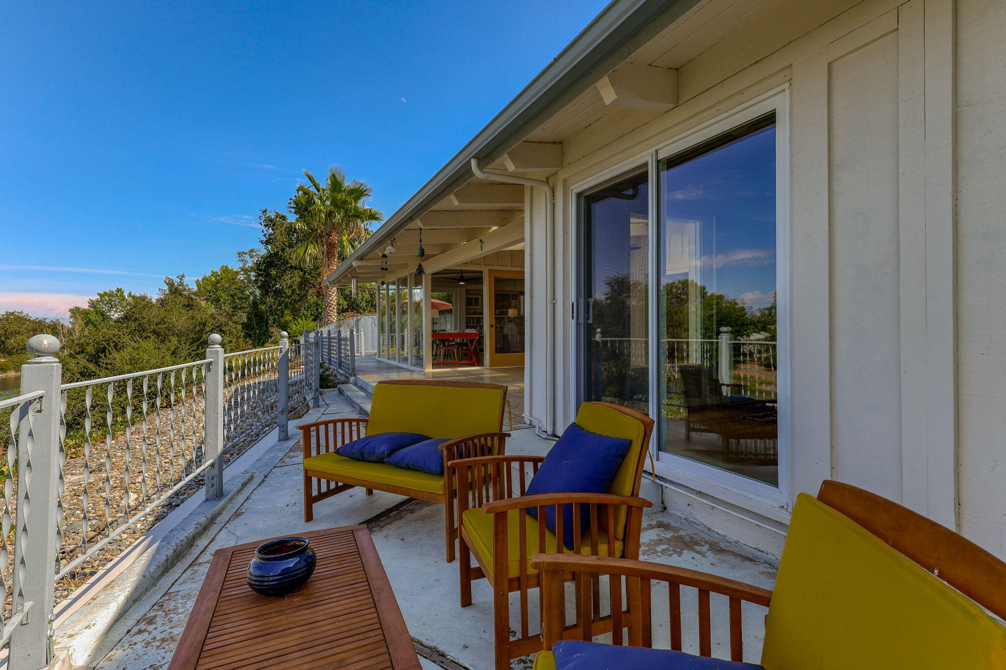 860 Rio Street Red Bluff, CA 96080 - Photo 46 of 50 a view of balcony with chairs and wooden fence