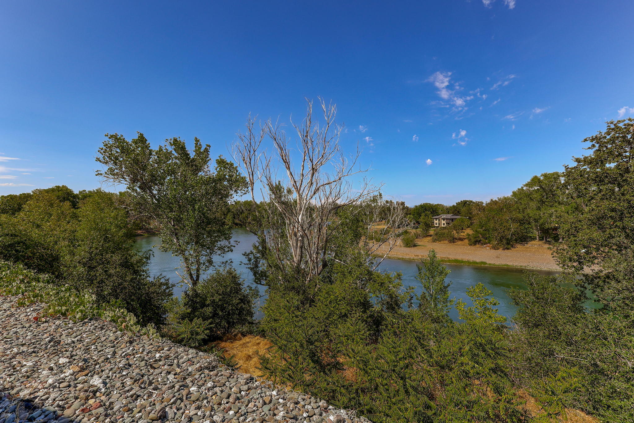 860 Rio Street Red Bluff, CA 96080 - Photo 48 of 50 a view of a lake with a house in the background