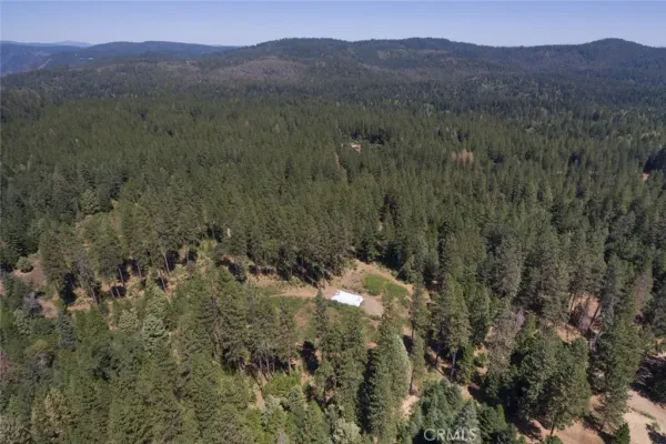 a view of a town with mountains in the background