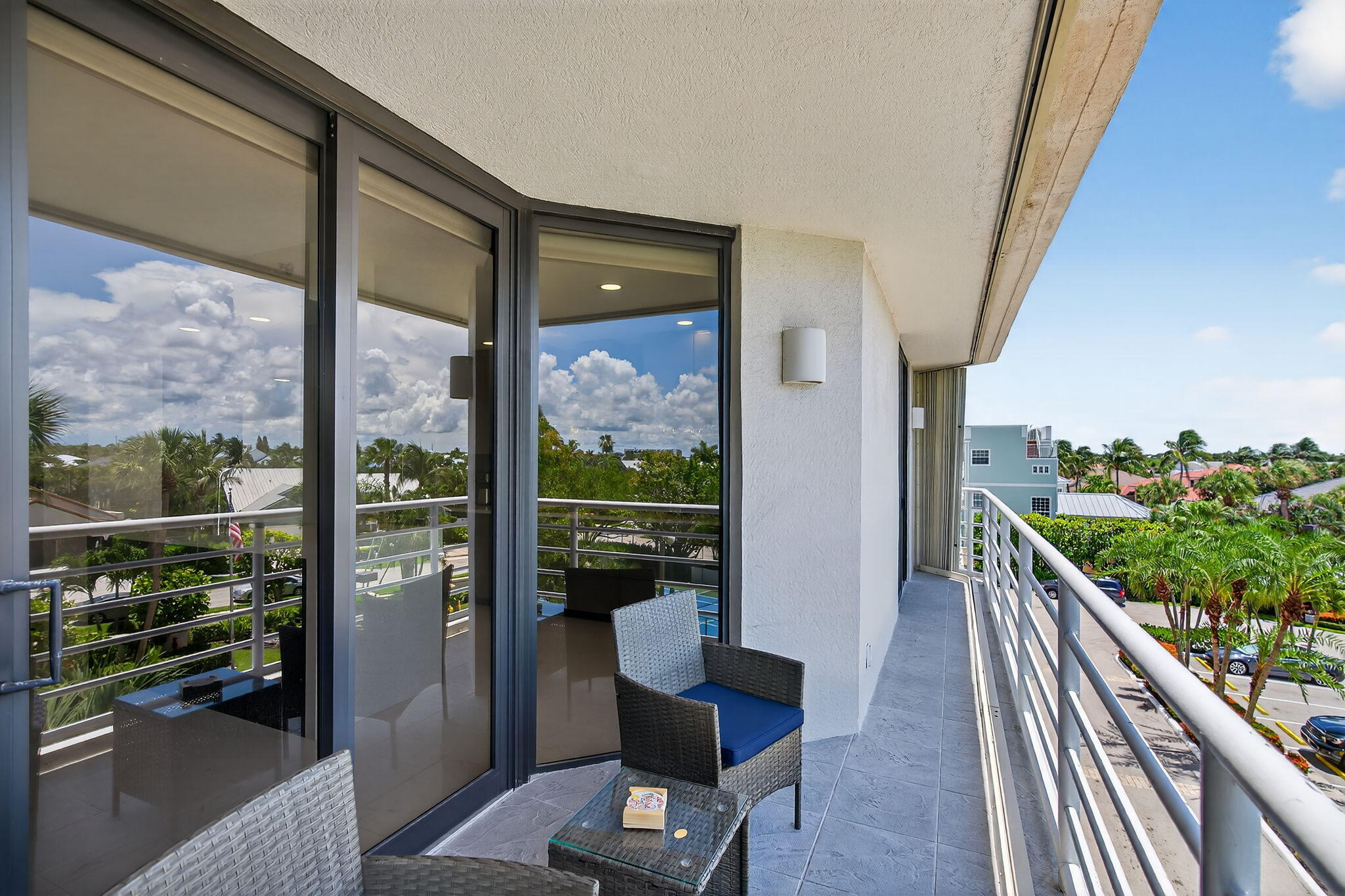 176 Helios Drive, Unit 210 Jupiter, FL 33477 - Photo 30 of 47 Balcony with Sunset and Tennis Views