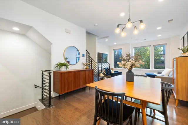 a dining room with furniture and chandelier
