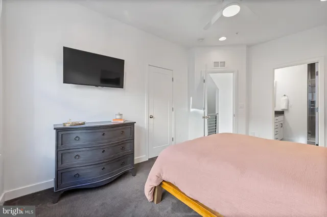 a bathroom with a double vanity sink a mirror and shower