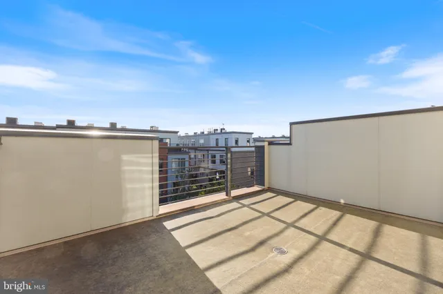 a balcony view with a glass door