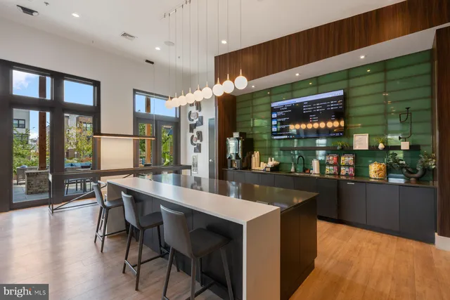 a living room with furniture a window and a chandelier