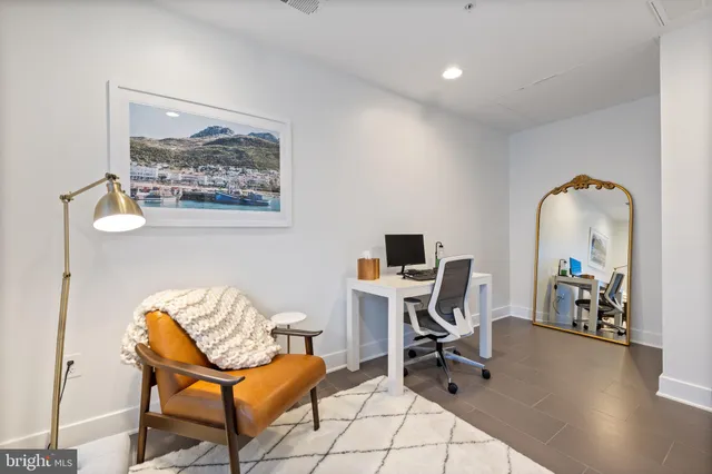 a view of workspace with wooden floor